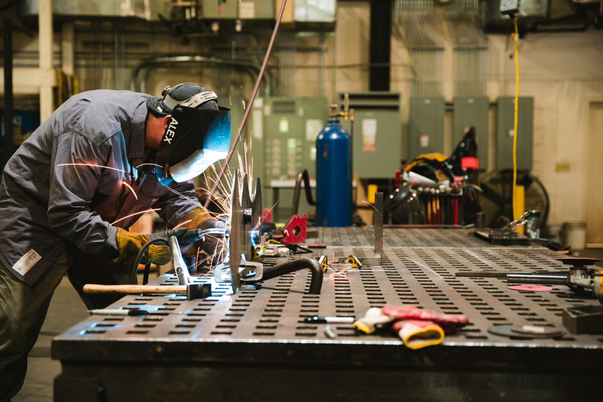 a man working on a piece of metal