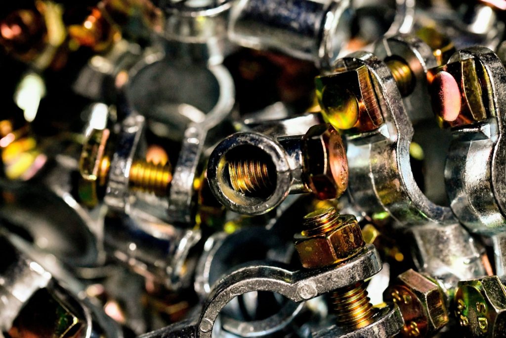 A pile of metal fittings and nuts
